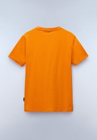 Orange cotton T-shirt with short sleeves, crew neck design, and a smooth texture. No visible patterns or graphics. Minor hem tag detail.