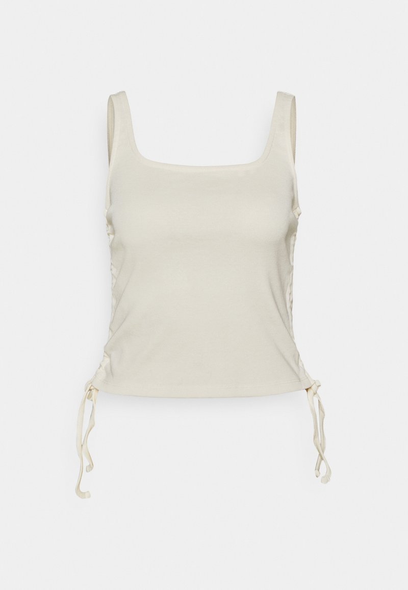 Light beige tank top with a square neckline, adjustable drawstrings at the sides, and a smooth, soft texture.