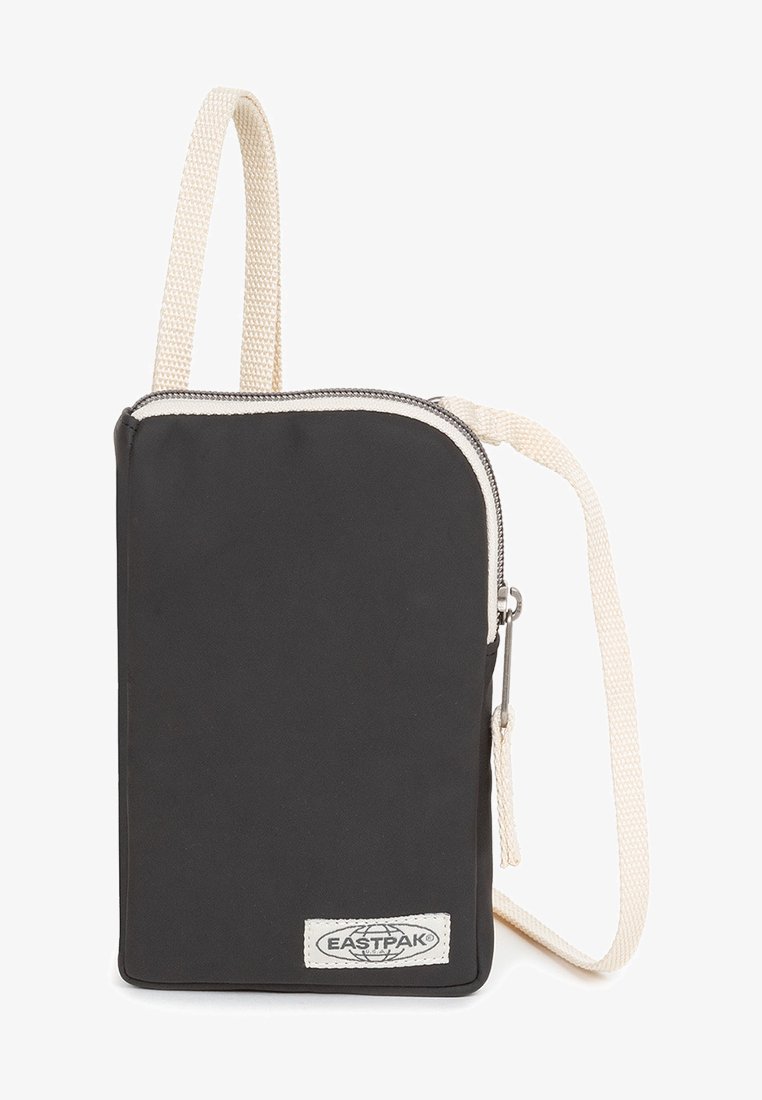 Black fabric shoulder bag with a rectangular shape, featuring a zip closure, light-colored strap, and a small branded label on the front.