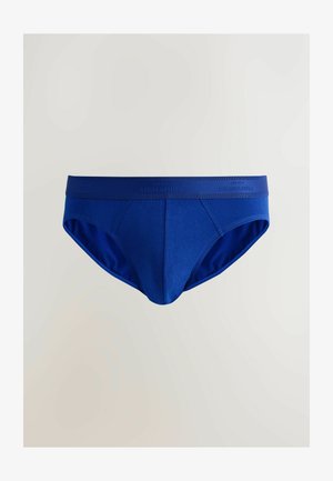 Blå herrkalsonger av mjukt tyg, med ett brett elastiskt midjeband märkt "NEXT SIGNATURE" och en klassisk modell utan mönster.