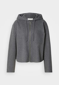 Sweat à capuche zippé gris foncé avec poche poitrine avant, manches longues, capuche à cordon de serrage et fermeture éclair métallique visible, présenté sur fond uni.