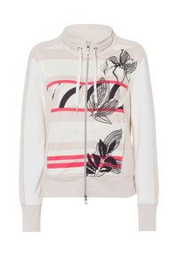 Lichtbeige ritsjack met een bloemendessin in zwart en roze, met een gestreept ontwerp, hoge kraag en elastische manchetten. Zachte stoftextuur.