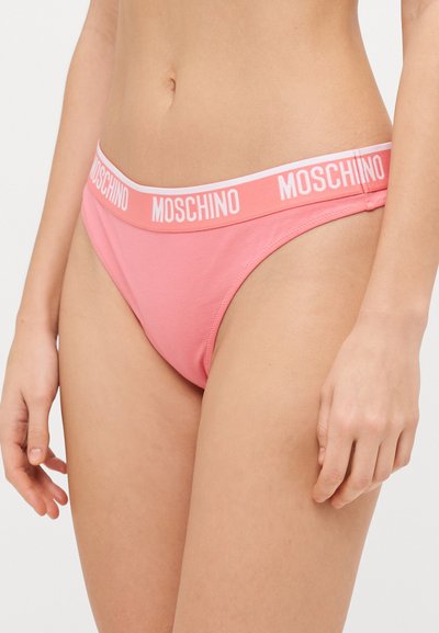 Pink cotton thong with a white, branded waistband. Features a smooth texture and a low-rise design.