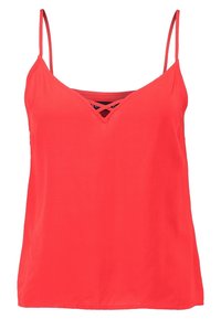 Camisole rouge sans manches avec fines bretelles, décolleté en V avec un design croisé, en tissu lisse.