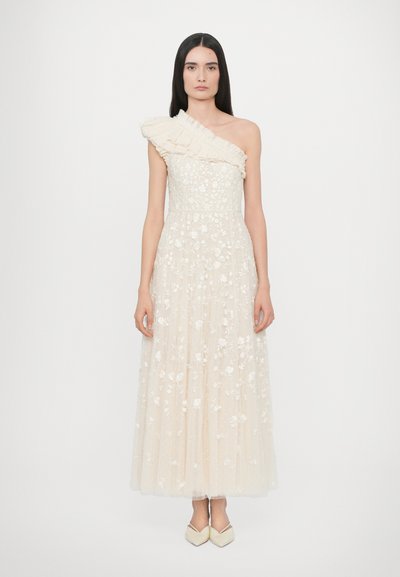 One-shoulder, floor-length dress in cream, adorned with floral embroidery and ruffled shoulder detailing. Soft, sheer fabric with textured layers.