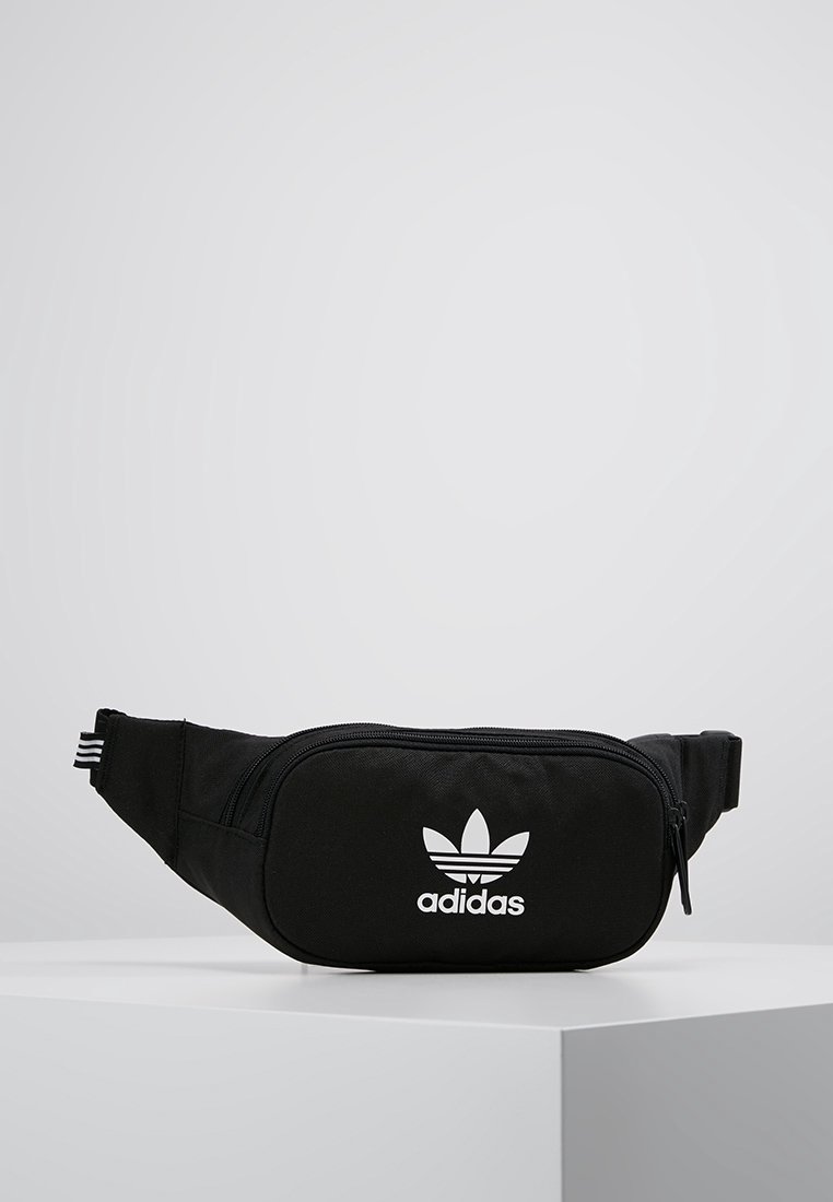 Black fanny pack made of durable fabric, featuring a zippered compartment and white Adidas logo with three-stripe detailing on the strap.