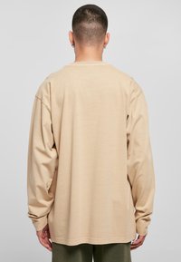 Urban Classics HEAVY OVERSIZED LONGSLEEVE - Bluză de molton - unionbeige