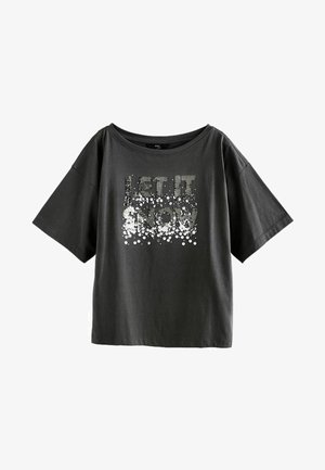 Mörkgrå oversized t-shirt i bomull med en silverpaljettsgrafik som stavar "LET IT SNOW" i en avslappnad, lös passform.