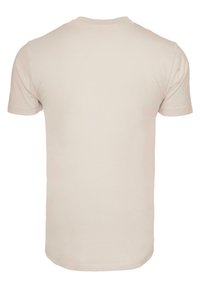 Light beige short-sleeve t-shirt with a round neckline, smooth texture, and a straight hemline. No graphics or designs visible.