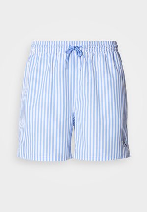 Costume da bagno a righe blu e bianche con vita elastica e coulisse. Presenta un piccolo logo sul lato inferiore destro. Tessuto dalla texture liscia.