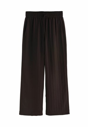 Schwarze, weit geschnittene Hose mit elastischem Bund und Seitentaschen, aus leichtem, leicht strukturiertem Stoff gefertigt.