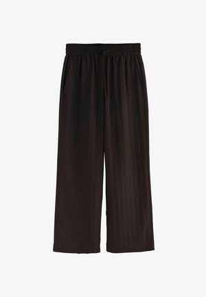 Schwarze, weit geschnittene Hose mit elastischem Bund und Seitentaschen, aus leichtem, leicht strukturiertem Stoff gefertigt.