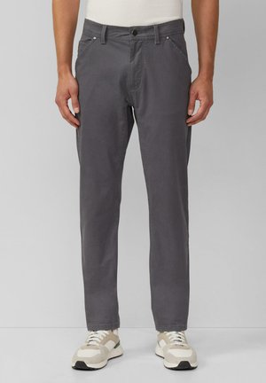 Gray cotton trousers with a slim fit, front pockets, button closure, and belt loops. Worn with light-colored, sporty sneakers.
