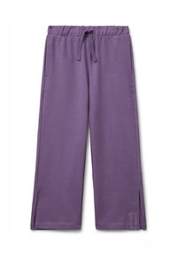 Pantalons de survêtement en coton violet avec une taille élastique, un cordon de serrage, des poches latérales et des fentes à l'ourlet. Présente un accent de logo en bas.