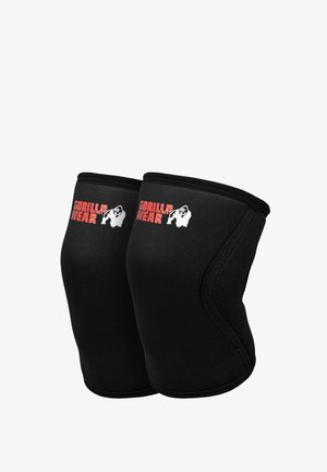 Een paar zwarte kniebeschermers met rood Gorilla Wear-logo en witte gorillagrafiek op elke, ontworpen voor gewrichtsondersteuning tijdens workouts.