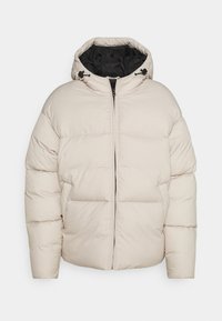 Puffer jacket in light beige with a zip closure, hood, and black interior lining. Features side pockets and a quilted design for insulation.