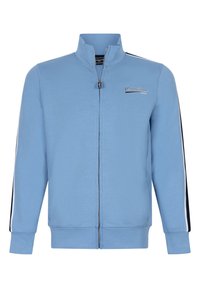 Ljusblå zip-jacka i mjuk tyg, med hög krage, kontrasterande svarta och vita sidostråk, samt broderad logotyp.