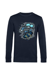 Felpa blu navy con un cartone animato di un uomo barbuto in un cappello che esegue un trick con lo skateboard, circondato da design in stile graffiti.