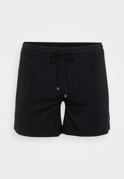 Melni ikdienas šorti ar elastīgu jostasvietu un virvi, ar īsu garumu un nelielu pogu detaļu sānos.