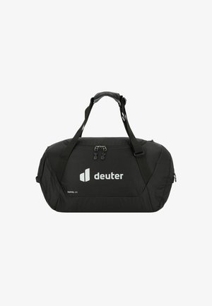 Borsa duffel nera con un design aerodinamico, caratterizzata da un logo bianco, manici doppi e un compartimento con zip per un facile accesso.