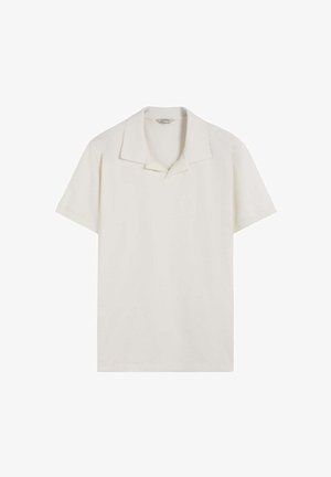 Licht beige short-sleeve polo met een puntkraag, voorzien van een gestructureerde stof en een losse pasvorm, zonder zichtbare logo's of patronen.