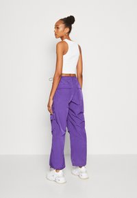 Tommy Jeans PARACHUTE WINDPANT - Jogginghose - college purple