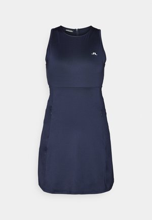 Mekko ilman hihoja, tummansininen, jossa on vartalonmyötäinen yläosa, vetoketjukiinnitys selässä ja kaksi sivutaskua. Sujuva pinta ja logo rintakehässä.