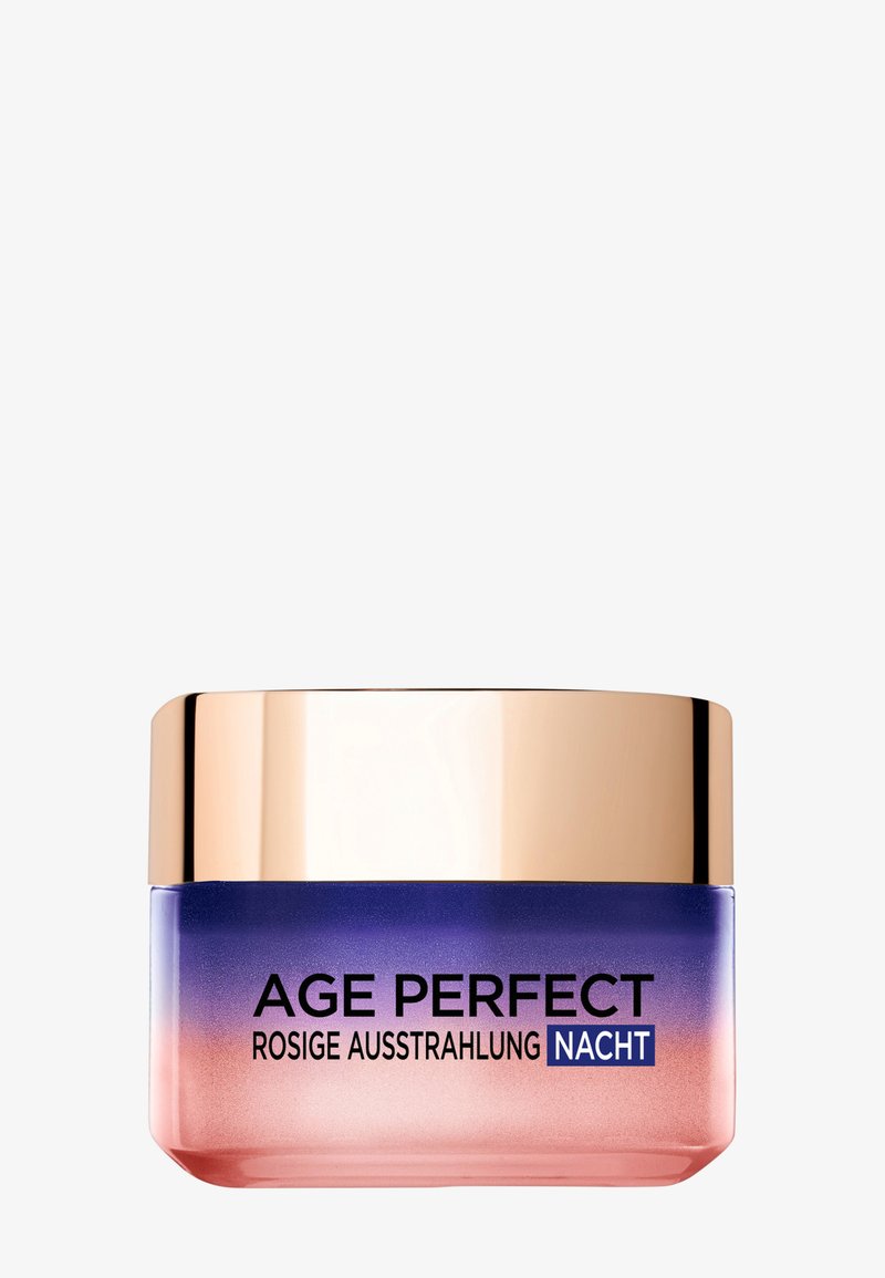 Glasburk med gradientfärg från rosa till lila, guldlock, märkt "AGE PERFECT ROSIGE AUSSTRAHLUNG NACHT." Slät yta, modern design.