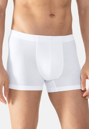 White mesh boxer briefs featuring a fitted design, elastic waistband with branding, and seamless sides for added comfort and breathability.