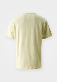Short-sleeve t-shirt in soft light yellow cotton. Features a v-shaped stitch at the neckline and a relaxed fit for comfort.