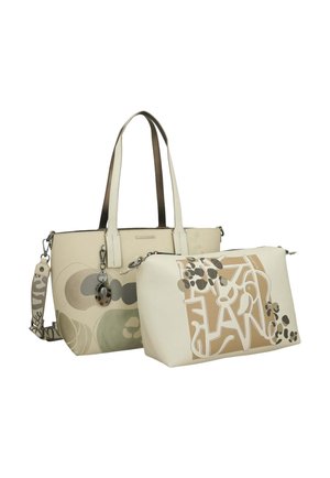 Beige Tragetasche mit abstrakten kreisförmigen Mustern und passendem kleineren Beutel mit braunem und cremefarbenem Graffiti-Design, beide mit Schultergurten.