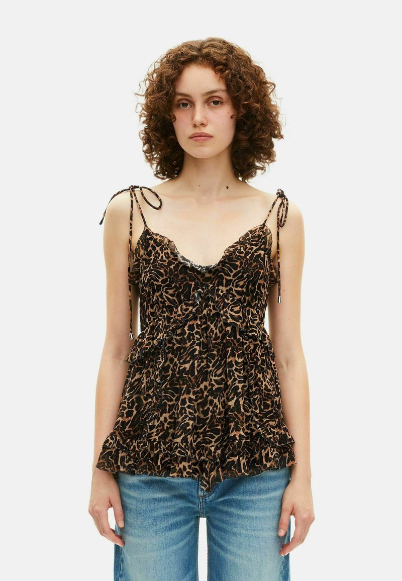 T-shirt sans manches à imprimé léopard avec un décolleté en V, des bretelles réglables et un ourlet volanté. Fabriqué en tissu léger dans des nuances de marron et de noir.