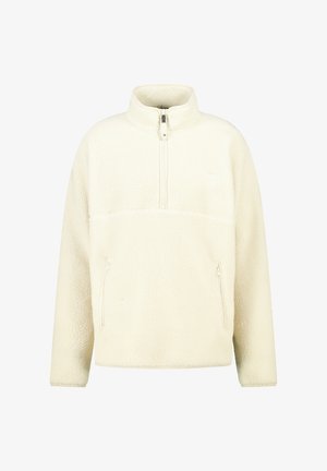 Sudadera de forro polar color crema con cuello de media cremallera, dos bolsillos laterales con cremallera y un exterior suave y texturizado.