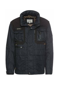 Marinejakke med høj krave, flere forlommer, en lynlås lommer på brystet og kontrasterende sorte detaljer på skuldrene. Struktureret indvendig foring.