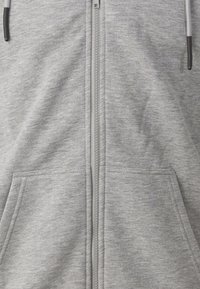 Sweat à capuche gris zippé en mélange de coton, doté de deux poches avant, d'une fermeture éclair centrale et de cordons de serrage avec embouts en plastique.