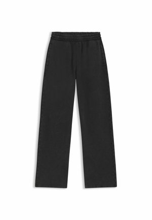 Pantalons larges noirs avec une taille élastique, texture douce et poches latérales. Design simpliste sans motifs ni éléments métalliques visibles.