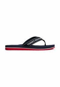 Infradito blu navy con una spessa cinghia che presenta il nome del marchio in bianco, una soletta in gomma e una suola rossa e bianca. Suola testurizzata per una migliore aderenza.