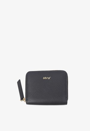 Leather wallet in black with textured finish, zip closure, and gold-tone logo. Features a small tag on one side. Compact rectangular shape.