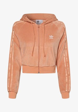 Cropped orange velour hoodie with a front zipper, two front pockets, and white three-stripe detailing along the sleeves. Features a logo.