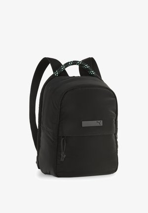 Sac à dos noir en tissu rembourré, fermeture zippée, et poche frontale. Doté de bretelles texturées en noir et d'accents turquoise.