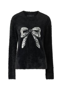Zwarte, fuzzy sweater met een pailletten strikontwerp aan de voorkant. Lange mouwen en ronde hals. Zachte textuur voor extra comfort.