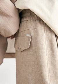 BOSS TAMAYA - Hlače - beige