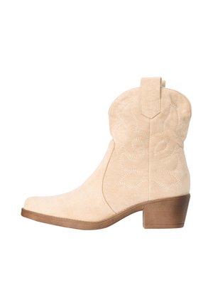 Beige suede ankle cowboy boot with embroidered details, pull tab, and medium brown stacked heel.