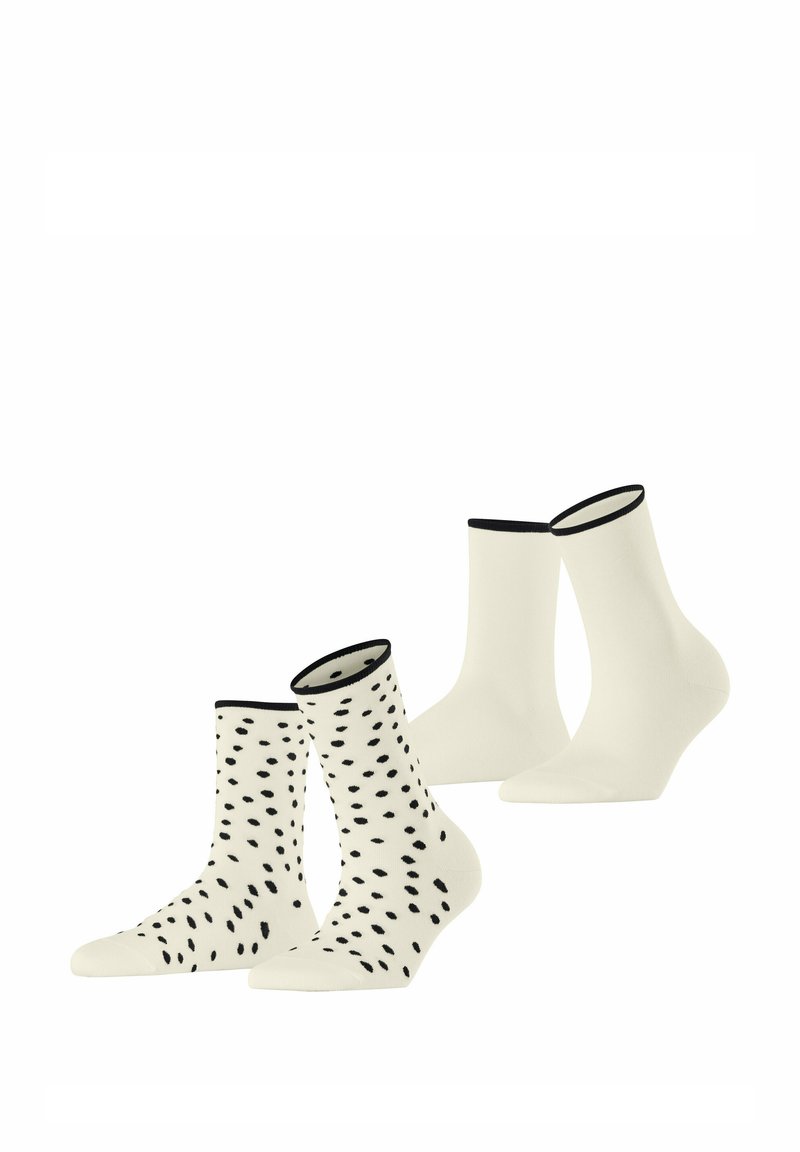 Zwei Paar Baumwollsocken: ein Paar in Creme mit schwarzem Punktmuster und ein einfarbiges Creme-Paar, beide mit schwarzem Saum am Knöchel.