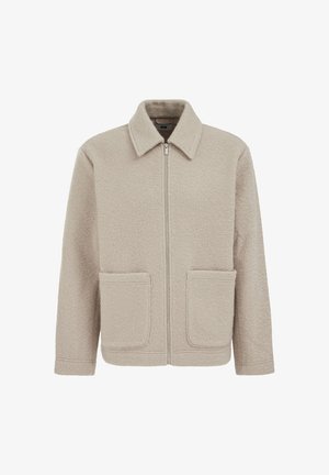 Smėlio spalvos flisinis švarkelis su užtrauktuku priekyje, smaigaluota apykakle ir dviem priekinėmis kišenėmis. Audinys turi minkštą, tekstūruotą išvaizdą.