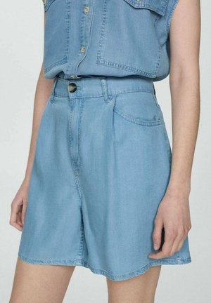 Light blue denim shorts with a high waist, side pockets, and a button closure. The fabric is soft with a smooth texture and clean hemline.