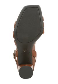 Brown leather sandal with a textured black rubber sole, featuring a central strap and adjustable buckle hardware on the side.