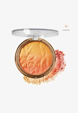 Bronzer i en rund guldcompact, der indeholder en blanding af orange og ferskenfarvede nuancer med blomstermotiver, ledsaget af løs pudderstøv.