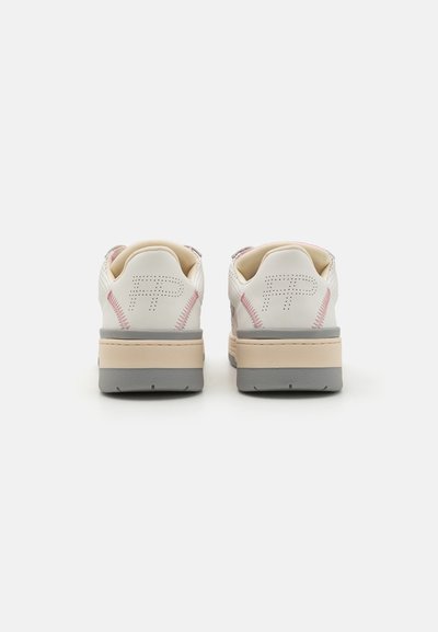 White sneakers with a smooth leather upper, perforated detailing, a pale pink accent, and a grey rubber sole. Rounded shape with stitched accents.