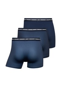 Three pairs of men's boxer briefs in navy. Features include a solid color, a geometric pattern, and a contrasting waistband with logo.